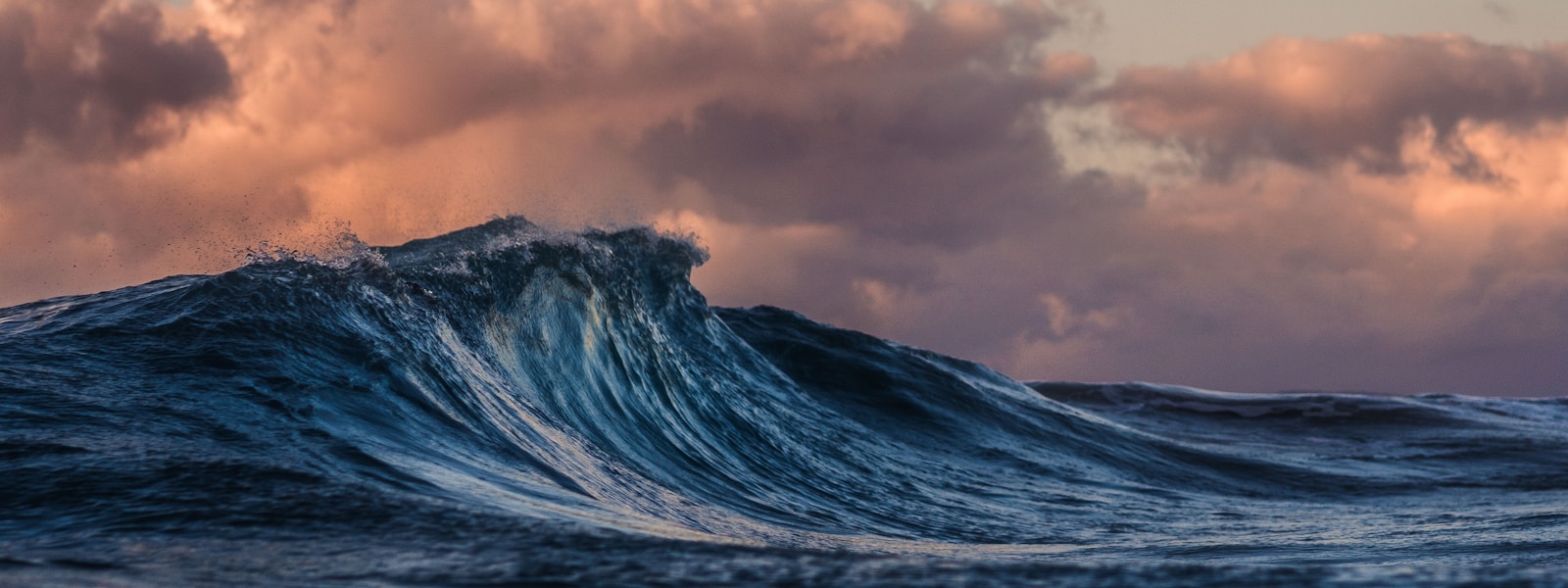 Clean sunset ocean waves for beach and outdoor essentials hero